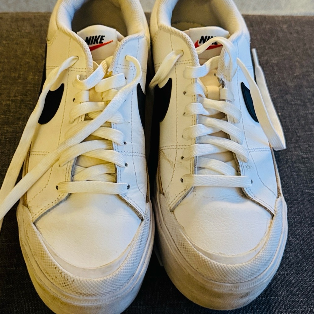 Nike White Sneakers with Black Swoosh and Cream Trim